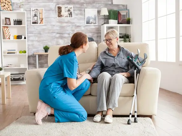 female nurse talking with an old woman